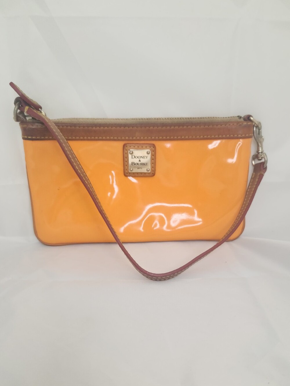 Dooney & Bourke Patent Orange Wristlet with Brown Trim